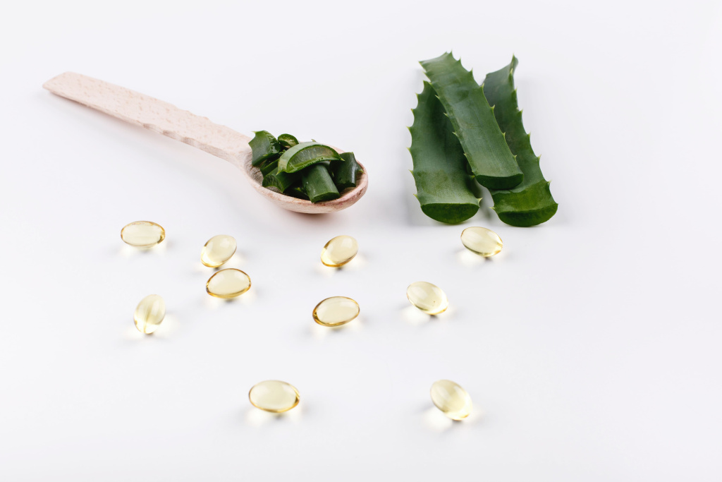 wooden-spoon-with-aloe-lies-white-table-with-golden-capsules-with-oil (1).jpg wooden-spoon-with-aloe-lies-white-table-with-golden-capsules-with-oil (1).jpg